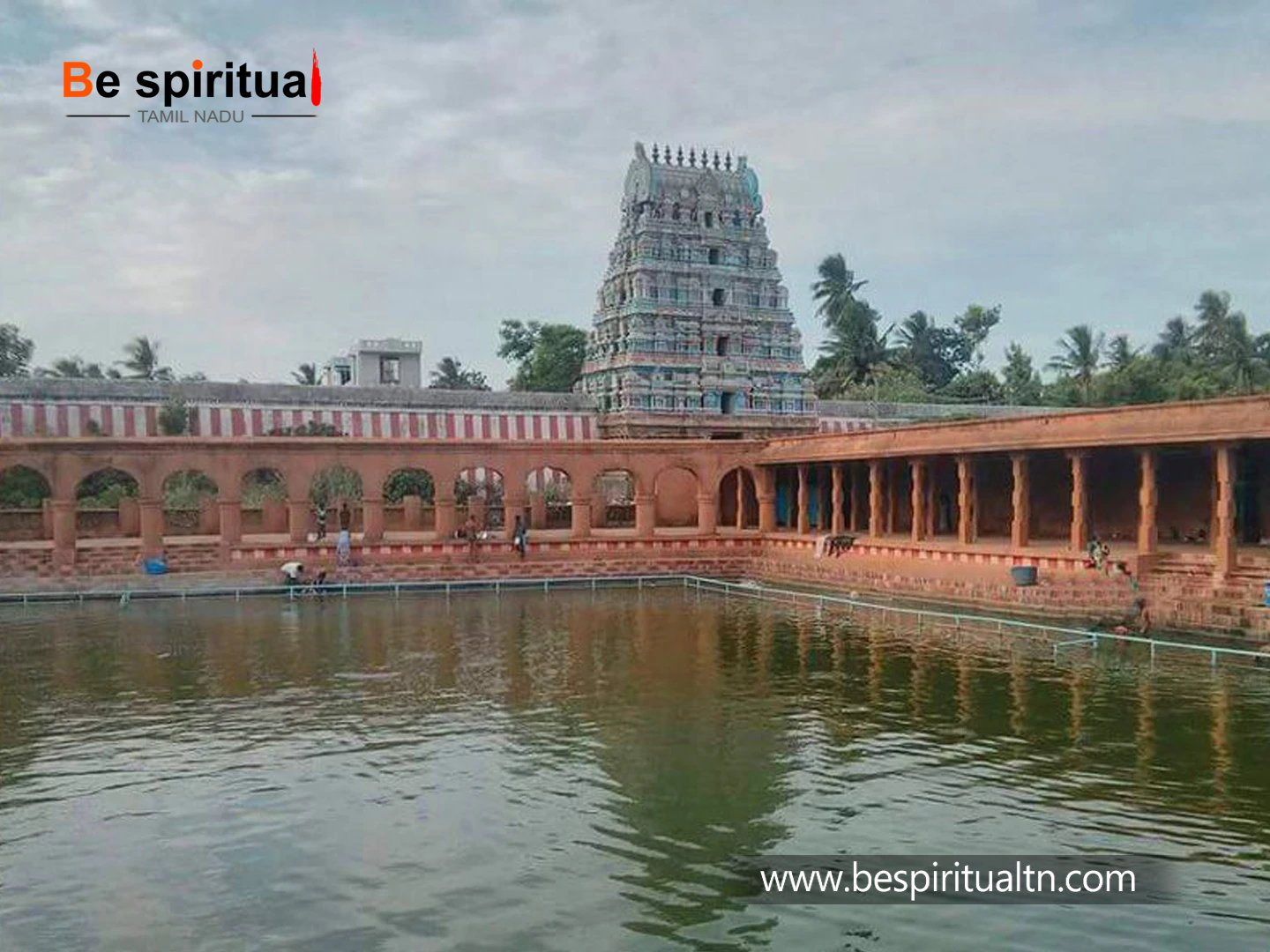 The calm of the Theppakulam mirrors the majesty above, where the Gopuram stands tall in devotion — a serene blend of water, worship, and heritage. copy